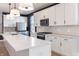 Updated kitchen featuring stainless appliances, sleek countertop, and stylish light fixtures at 2051-2053 Columbia Ave, Indianapolis, IN 46202