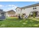 Spacious backyard featuring multiple gazebos and outdoor seating areas, ideal for entertaining and relaxation at 210 Lynnette Way, Cumberland, IN 46229