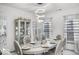 Bright dining room with unique chandelier and seating for six at 210 Lynnette Way, Cumberland, IN 46229