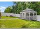 Charming gazebo in a landscaped backyard, providing a tranquil spot for relaxation and outdoor enjoyment at 210 Lynnette Way, Cumberland, IN 46229