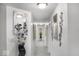 Well-lit hallway featuring decorative mirrors and modern accents at 210 Lynnette Way, Cumberland, IN 46229