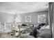 Upstairs living room features a plush sofa and decoratively adorned accent pieces at 210 Lynnette Way, Cumberland, IN 46229