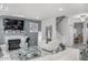 Spacious living room boasts a fireplace, marble floors, an open staircase, and easy access to dining area at 210 Lynnette Way, Cumberland, IN 46229