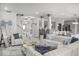 Inviting living room with stylish furnishings, modern decor, an open layout, and seamless access to kitchen at 210 Lynnette Way, Cumberland, IN 46229