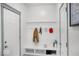 Welcoming mudroom with a built-in bench, storage, and coat hooks for organization at 210 Lynnette Way, Cumberland, IN 46229