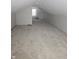 This finished attic has carpeting, paneling, and a window at 2250 N Goodlet Ave, Indianapolis, IN 46222