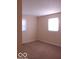 Bedroom with neutral carpeting and two windows offering natural light at 2250 N Goodlet Ave, Indianapolis, IN 46222