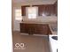 Kitchen with wooden cabinets and ample countertop space at 2250 N Goodlet Ave, Indianapolis, IN 46222