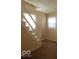 Cozy living room featuring neutral walls, wall to wall carpeting, and bright windows at 2250 N Goodlet Ave, Indianapolis, IN 46222