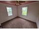Cozy bedroom with large windows and carpet floors, perfect for relaxation at 2411 Harlan St, Indianapolis, IN 46203