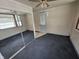 Bedroom with a mirrored closet and a back door for easy access to the outdoors at 2411 Harlan St, Indianapolis, IN 46203