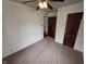 Comfortable bedroom with a ceiling fan and traditional wood doors to add character at 2411 Harlan St, Indianapolis, IN 46203