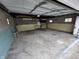 Spacious garage providing ample storage and workspace with visible concrete flooring at 2411 Harlan St, Indianapolis, IN 46203