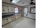 Kitchen with lots of counter space and cabinets with unique hardware at 2411 Harlan St, Indianapolis, IN 46203