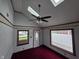 Bright living room with carpet floors, and skylights, showcasing the room's layout at 2411 Harlan St, Indianapolis, IN 46203