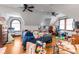 Spacious attic featuring wood floors, multiple ceiling fans, and natural light at 3018 S Anthony Blvd, Fort Wayne, IN 46806
