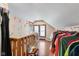 Finished attic space featuring wood floors, natural light, and ample storage at 3018 S Anthony Blvd, Fort Wayne, IN 46806