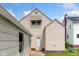 A two-story house with vinyl siding and a detached one car garage on a green lawn at 3018 S Anthony Blvd, Fort Wayne, IN 46806