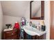 This bathroom features a vanity, wood floors, and a mirror above the sink at 3018 S Anthony Blvd, Fort Wayne, IN 46806