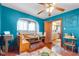 Open dining area with built-in bench seating, vintage lighting and direct access to the kitchen at 3018 S Anthony Blvd, Fort Wayne, IN 46806