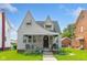 Attractive home featuring a covered porch, well-kept lawn, and traditional architecture at 3018 S Anthony Blvd, Fort Wayne, IN 46806