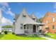 Charming two-story home featuring awnings and a covered front porch at 3018 S Anthony Blvd, Fort Wayne, IN 46806