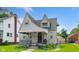 Quaint home showcasing a covered front porch and neat landscaping at 3018 S Anthony Blvd, Fort Wayne, IN 46806