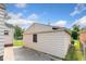 View of the side and back of a detached one car garage with a dark asphalt driveway at 3018 S Anthony Blvd, Fort Wayne, IN 46806