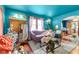Eclectic living room featuring colorful walls, vintage furniture, and hardwood floors at 3018 S Anthony Blvd, Fort Wayne, IN 46806