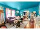 Vibrant living room with hardwood floors, a comfortable sofa, and an open layout at 3018 S Anthony Blvd, Fort Wayne, IN 46806