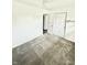 Bright carpeted bedroom with a ceiling fan and a closet at 3103 Keswick Rd, Indianapolis, IN 46222