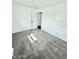 Bright carpeted bedroom with a closet and natural light at 3103 Keswick Rd, Indianapolis, IN 46222