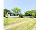 Charming home with a well-maintained lawn, landscaping, and mature shade trees at 3103 Keswick Rd, Indianapolis, IN 46222