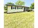 Charming home with a well-maintained lawn, landscaping, and shutters at 3103 Keswick Rd, Indianapolis, IN 46222