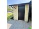 Exterior shot of a storage shed, with a black painted door and security lighting at 3103 Keswick Rd, Indianapolis, IN 46222