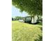 Well maintained house with a lush green lawn and mature trees at 3103 Keswick Rd, Indianapolis, IN 46222