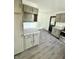 Modern kitchen featuring stone countertops and stylish cabinets at 3103 Keswick Rd, Indianapolis, IN 46222