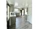 Updated kitchen features modern appliances, granite countertops and luxury vinyl flooring at 3103 Keswick Rd, Indianapolis, IN 46222