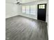 Bright living room with hardwood floors and a large window at 3103 Keswick Rd, Indianapolis, IN 46222
