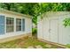 View of the home's exterior, a shed, and a well-maintained lawn offering space for outdoor activities at 3149 Carson Ave, Indianapolis, IN 46227