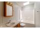 A full bathroom with a shower and bath tub combination and wooden vanity at 3149 Carson Ave, Indianapolis, IN 46227