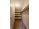 This is a large walk-in closet with built in shelving and hanging rods at 3149 Carson Ave, Indianapolis, IN 46227