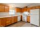 Well-organized kitchen featuring light oak cabinets, white appliances, and functional layout at 3149 Carson Ave, Indianapolis, IN 46227