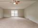 Spacious living room with carpet, neutral colored walls and a window that provides natural light at 3149 Carson Ave, Indianapolis, IN 46227