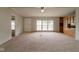 Spacious living room with neutral carpet and a large window for ample natural light at 3149 Carson Ave, Indianapolis, IN 46227