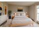 Serene main bedroom with a comfy bed, soft lighting, and minimalist decor at 3149 Carson Ave, Indianapolis, IN 46227