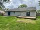 Backyard with a wooden deck and sliding glass doors, perfect for enjoying outdoor living and entertainment at 3259 Pawnee Dr, Indianapolis, IN 46235