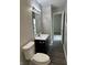 Bathroom featuring a new vanity, modern flooring, updated lighting, and fixtures at 3259 Pawnee Dr, Indianapolis, IN 46235