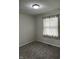 Cozy bedroom featuring new carpet and a window with sheer curtains, creating a bright and inviting atmosphere at 3259 Pawnee Dr, Indianapolis, IN 46235