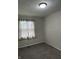 Bedroom featuring carpet flooring, neutral paint, and window with sheer curtains at 3259 Pawnee Dr, Indianapolis, IN 46235